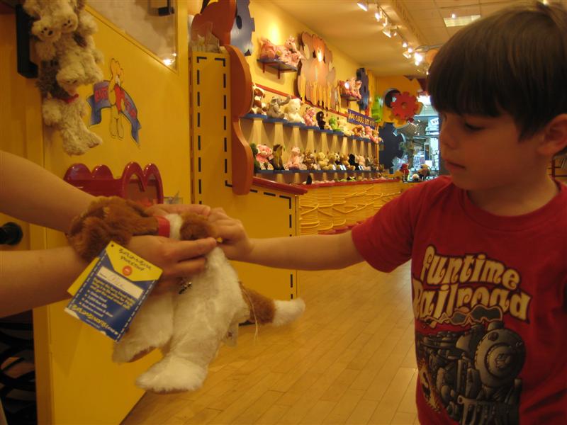 Jess_Build-A-Bear_K-6.JPG - Here's my big brother giving his stuffed dog (he named "Keighley") a heart!...