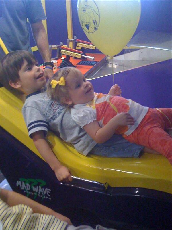 Jess_ChuckECheeseWBro-2.jpg - This is what I'm taking about....  motion coaster time... Can you say 5 minute massage for a mere .25 cents?