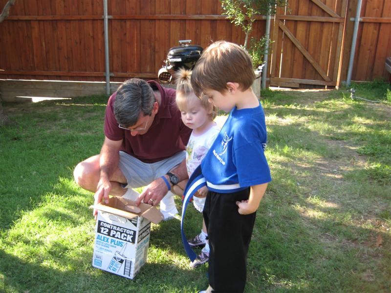 Jess_DaddyAlex&Toadie.JPG - "Aw man.  What's in the box?!"  (I'll give you bonus points if you can name the movie!?)
